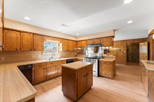 a kitchen with lots of counter top space and appliances