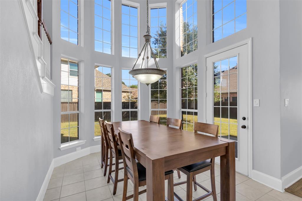 4306 Mitchell Lane Rowlett, TX 75088 - Photo 12 of 39 Dining area featuring light tile patterned floors and a towering ceiling