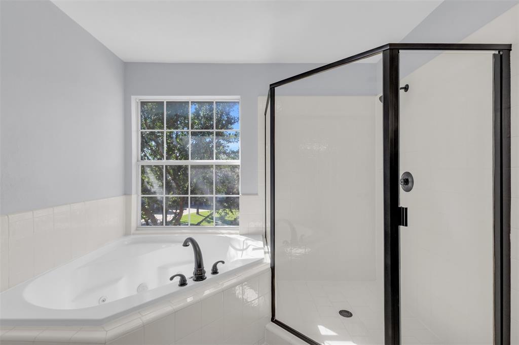 4306 Mitchell Lane Rowlett, TX 75088 - Photo 20 of 39 Full bath featuring a whirlpool tub and a shower stall