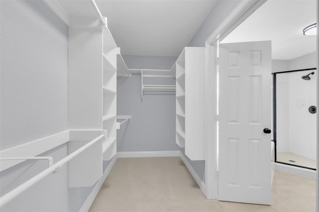 4306 Mitchell Lane Rowlett, TX 75088 - Photo 21 of 39 Walk in closet featuring light colored carpet
