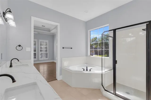 a white bath tub sitting next to a window