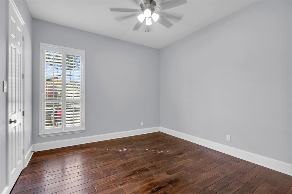 4306 Mitchell Lane Rowlett, TX 75088 - Photo 28 of 39 Spare room with dark wood finished floors and a ceiling fan