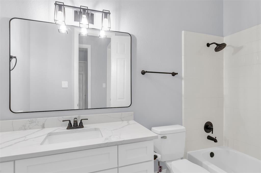 4306 Mitchell Lane Rowlett, TX 75088 - Photo 29 of 39 Full bathroom with shower / bathtub combination and vanity