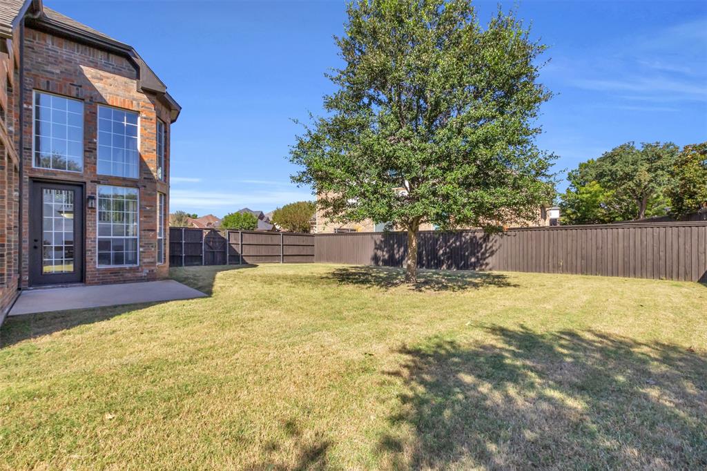 4306 Mitchell Lane Rowlett, TX 75088 - Photo 34 of 39 Fenced backyard featuring a patio area