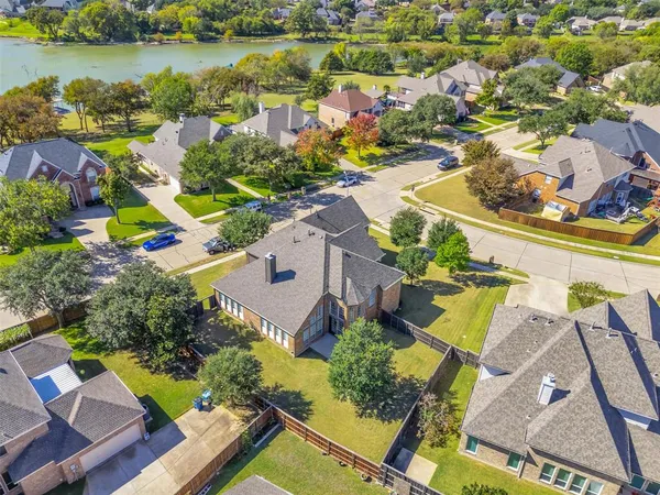 an aerial view of a house with a lake view