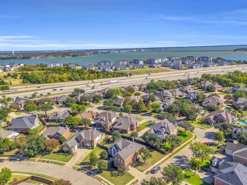 4306 Mitchell Lane Rowlett, TX 75088 - Photo 39 of 39 Aerial perspective of suburban area featuring a nearby body of water and a main thoroughfare