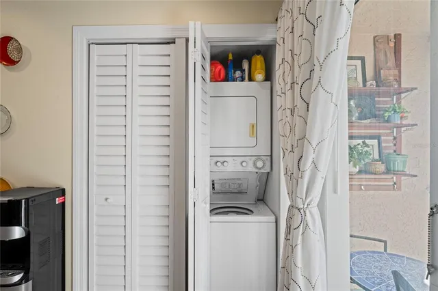 a bedroom with a bed a dresser and a large mirror