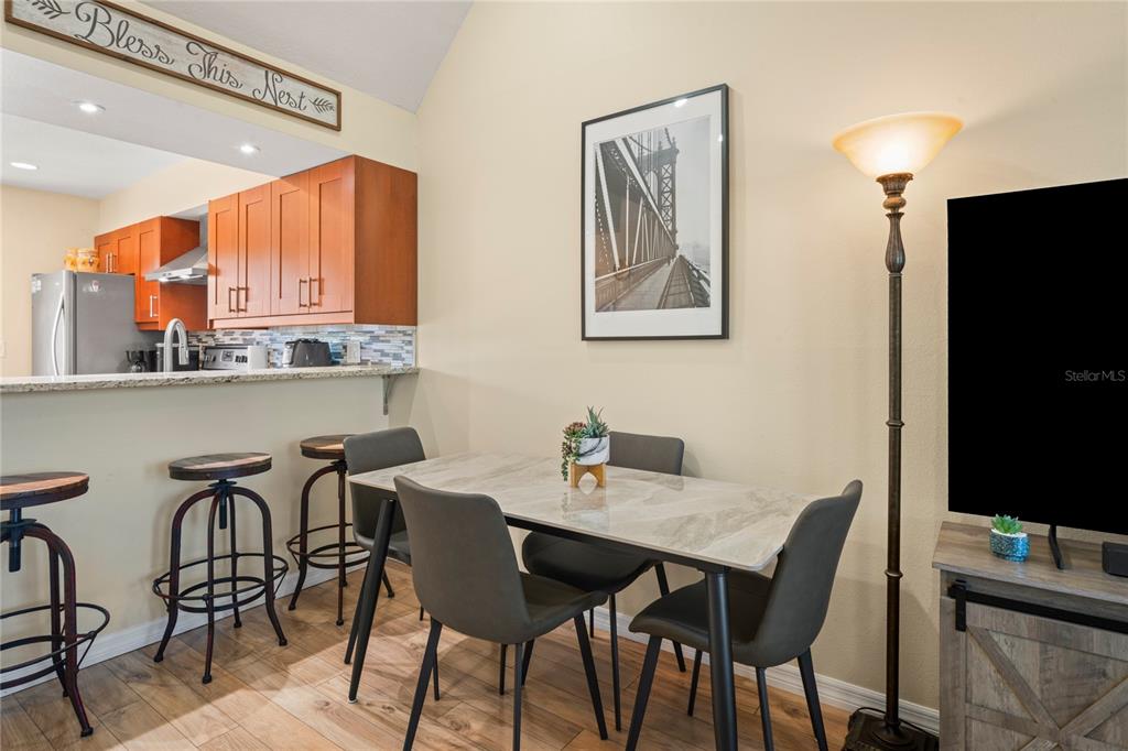 6424 Spring Flower Drive, Unit 24 New Port Richey, FL 34653 - Photo 13 of 66 a view of a dining room with furniture