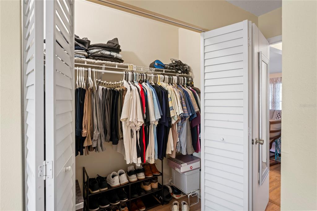 6424 Spring Flower Drive, Unit 24 New Port Richey, FL 34653 - Photo 18 of 66 a view of walk in closet with clothes