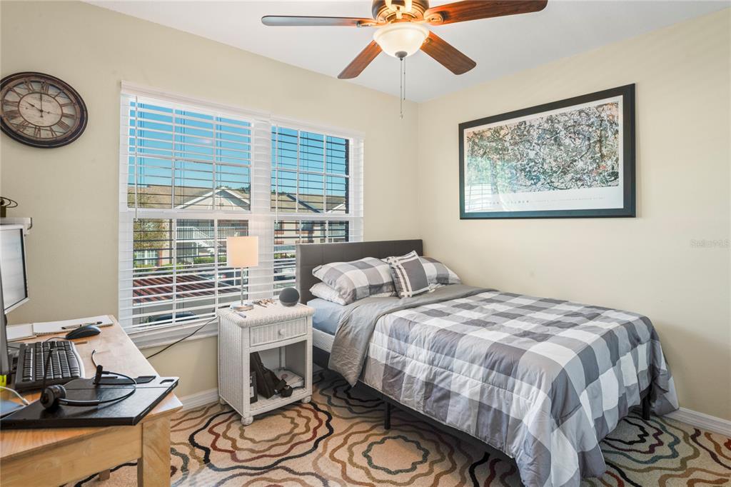 6424 Spring Flower Drive, Unit 24 New Port Richey, FL 34653 - Photo 21 of 66 a bedroom with a bed and a window
