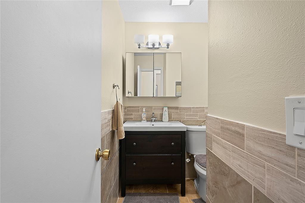 6424 Spring Flower Drive, Unit 24 New Port Richey, FL 34653 - Photo 24 of 66 a bathroom with a sink and a mirror