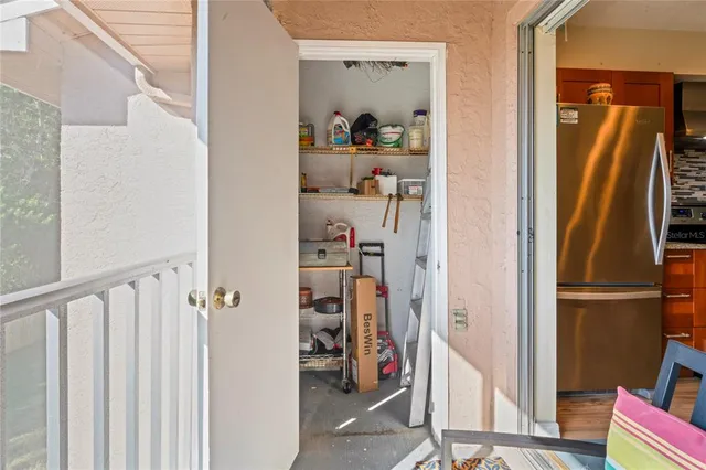 an aerial view of multiple houses with a yard
