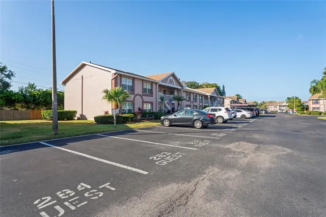 an aerial view of a house with swimming pool and outdoor seating