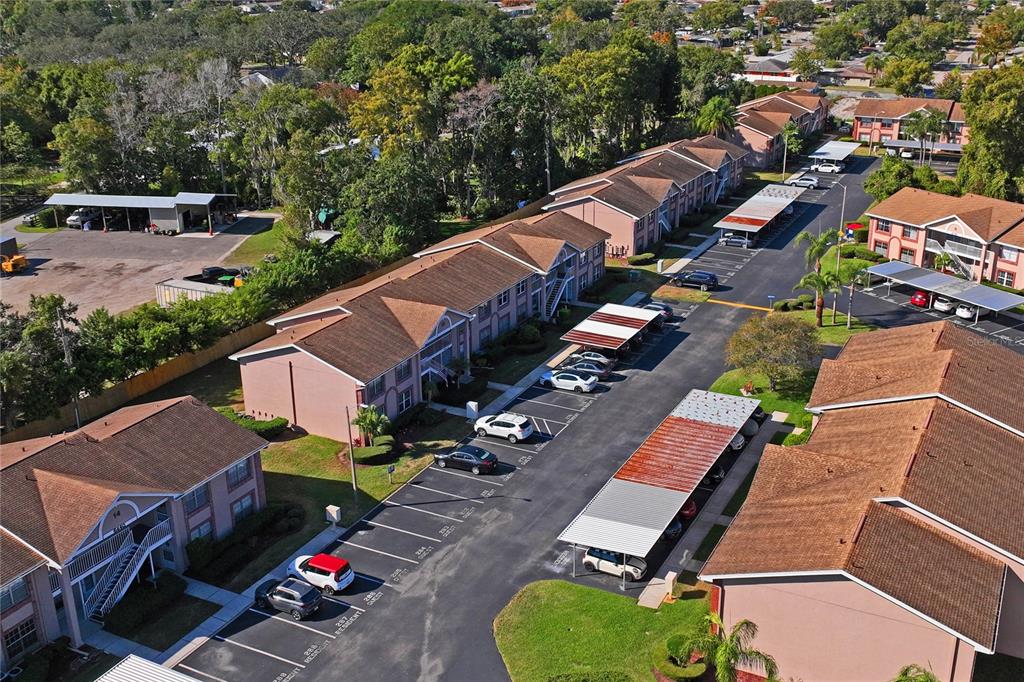 6424 Spring Flower Drive, Unit 24 New Port Richey, FL 34653 - Photo 39 of 66 an aerial view of a tennis ground and a cars park side of the road