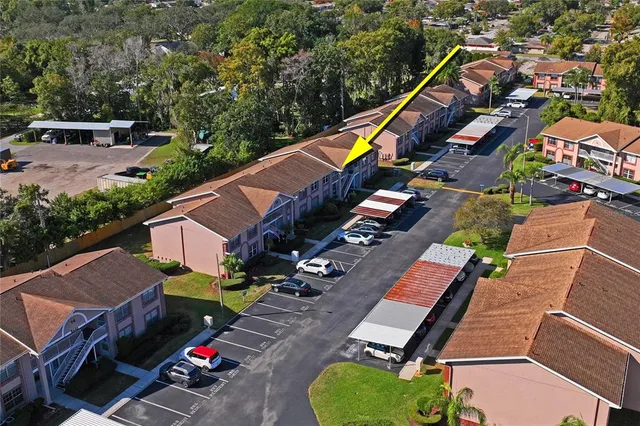 an aerial view of a house with outdoor space pool seating area and yard