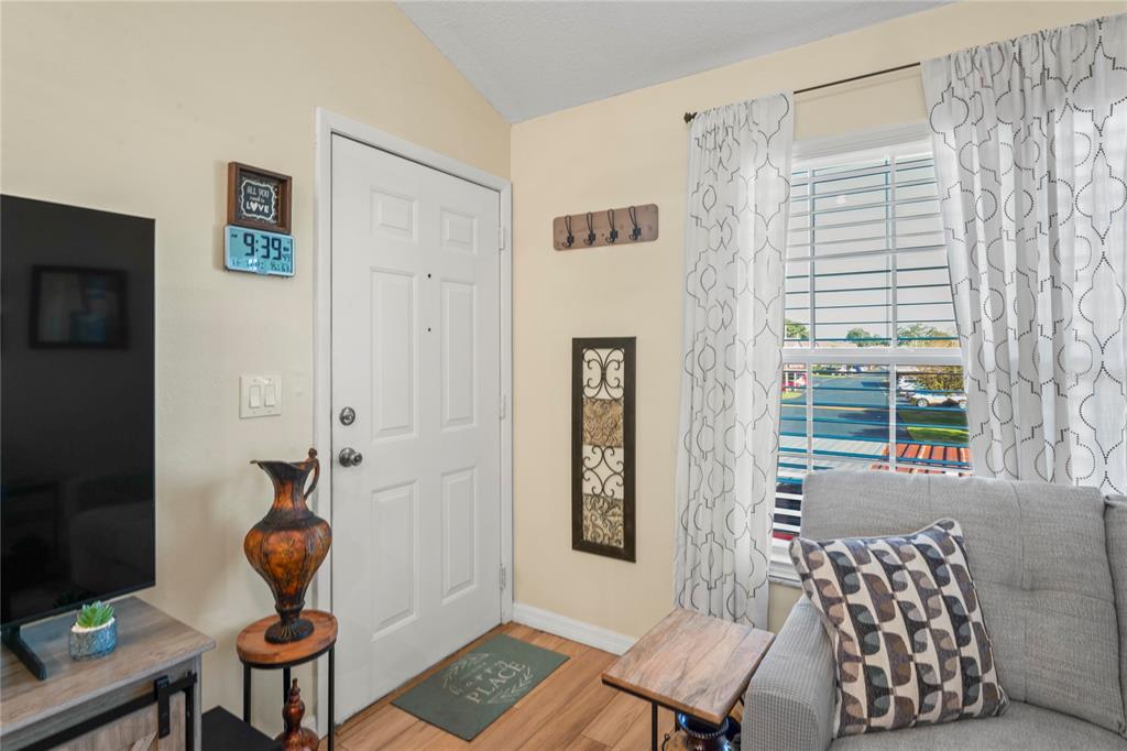 6424 Spring Flower Drive, Unit 24 New Port Richey, FL 34653 - Photo 4 of 66 a living room with furniture and a window