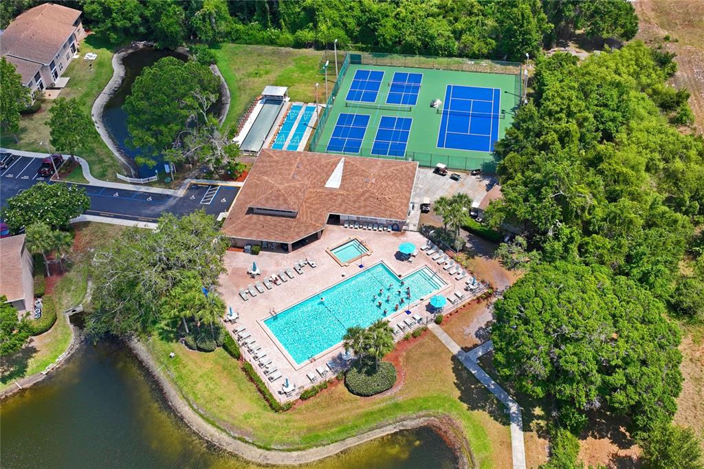 6424 Spring Flower Drive, Unit 24 New Port Richey, FL 34653 - Photo 51 of 66 an aerial view of a house with outdoor space pool seating area and yard