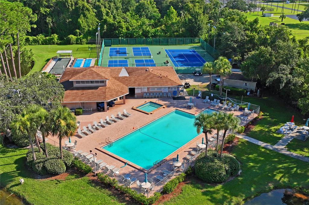 6424 Spring Flower Drive, Unit 24 New Port Richey, FL 34653 - Photo 60 of 66 an aerial view of a house with a yard basket ball court and outdoor seating
