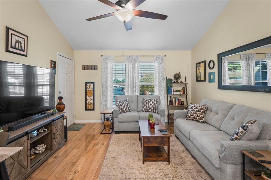 6424 Spring Flower Drive, Unit 24 New Port Richey, FL 34653 - Photo 6 of 66 a living room with furniture and a flat screen tv