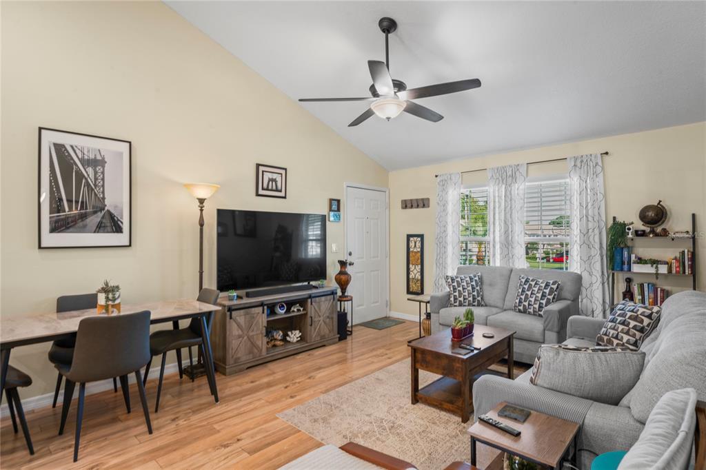6424 Spring Flower Drive, Unit 24 New Port Richey, FL 34653 - Photo 7 of 66 a living room with furniture and a flat screen tv