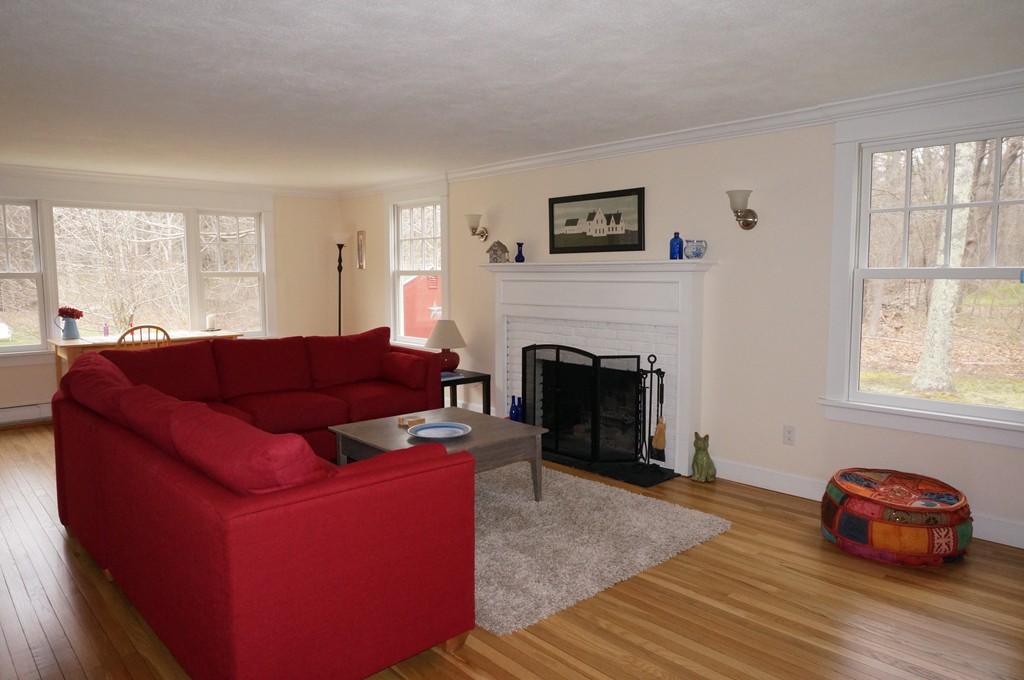 18 Jacob Gates Road Harvard, MA 01451 - Photo 11 of 26 a living room with furniture and a fireplace
