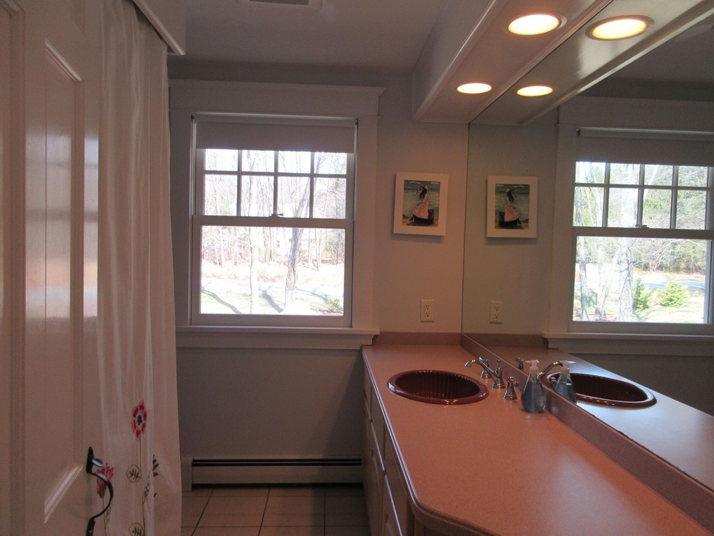 18 Jacob Gates Road Harvard, MA 01451 - Photo 15 of 26 a bathroom with a sink and a window