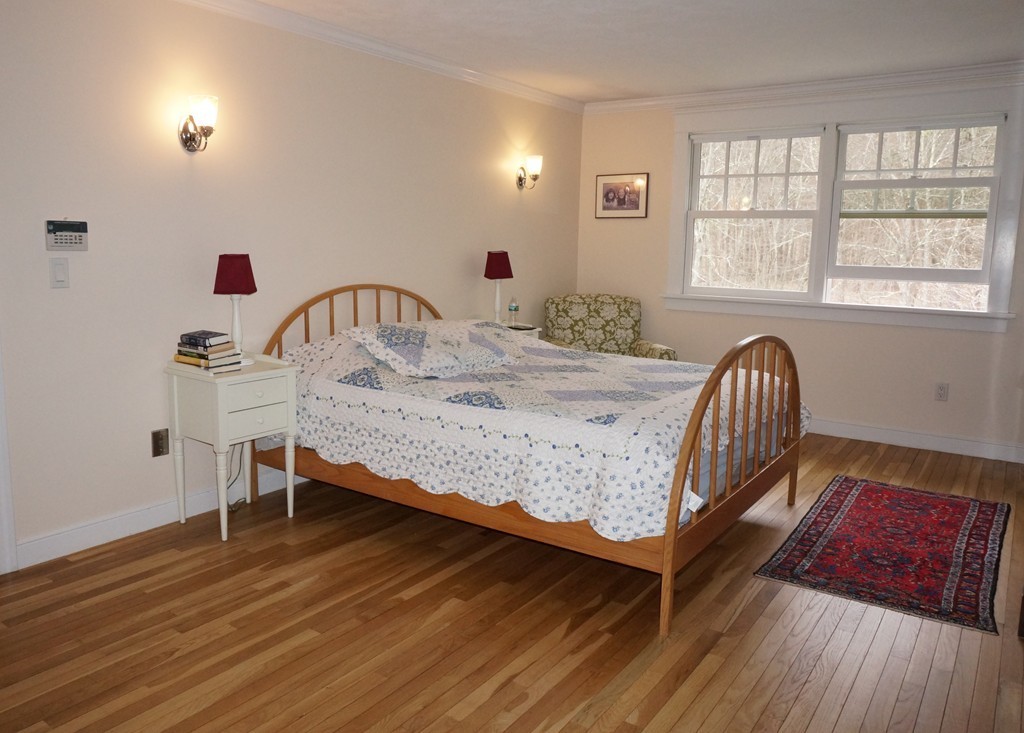 18 Jacob Gates Road Harvard, MA 01451 - Photo 16 of 26 a bedroom with a bed and a window