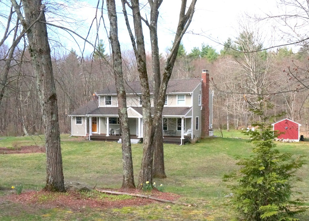 18 Jacob Gates Road Harvard, MA 01451 - Photo 2 of 26 a front view of house with yard and trees