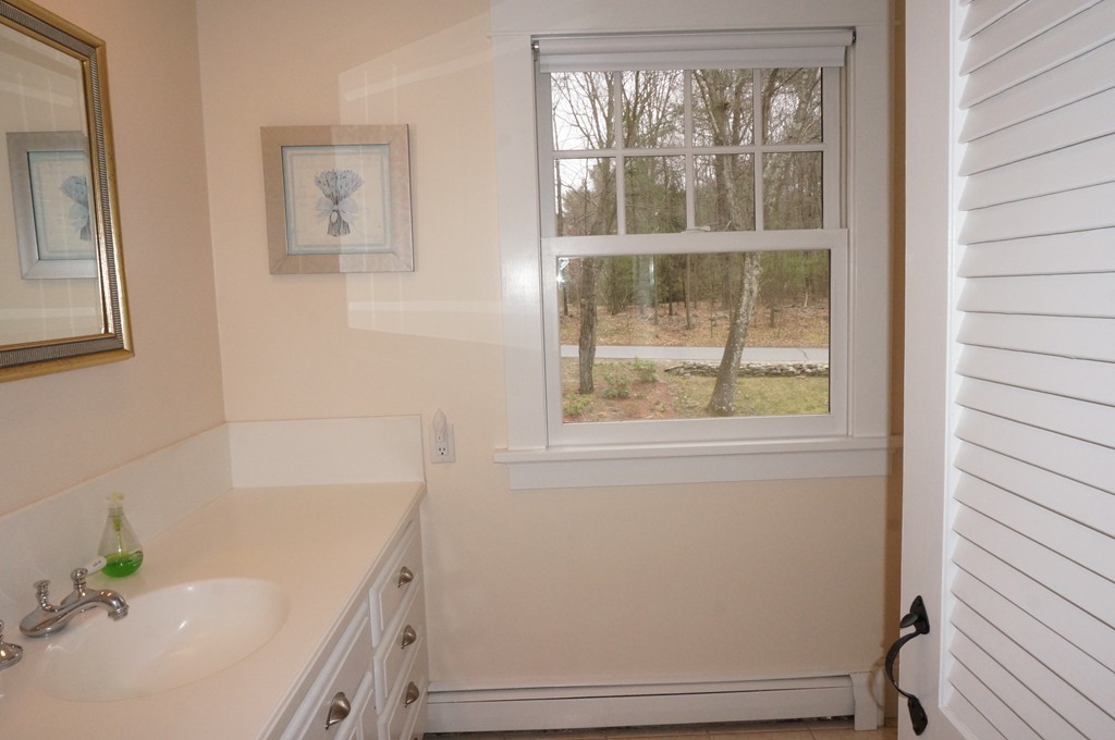 18 Jacob Gates Road Harvard, MA 01451 - Photo 23 of 26 a bathroom with a bathtub and window