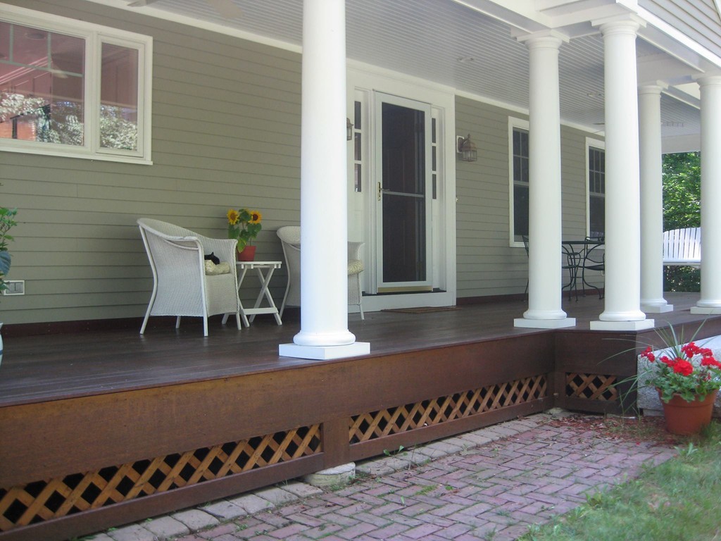 18 Jacob Gates Road Harvard, MA 01451 - Photo 3 of 26 a view of a patio with table and chairs and potted plants