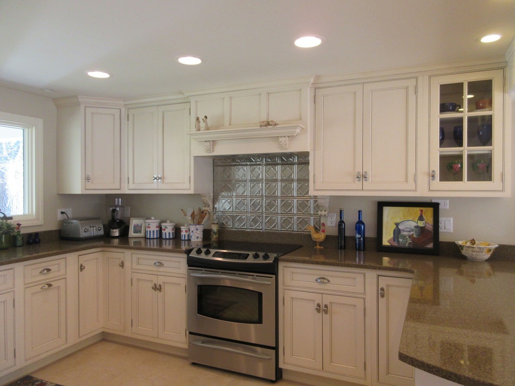 18 Jacob Gates Road Harvard, MA 01451 - Photo 4 of 26 a kitchen with granite countertop white cabinets and white appliances