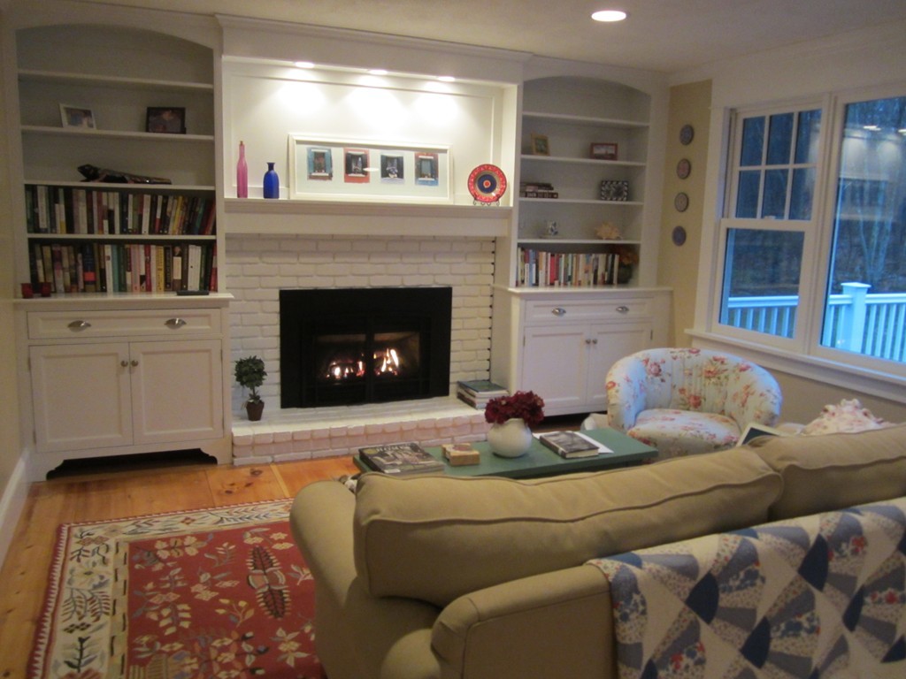 18 Jacob Gates Road Harvard, MA 01451 - Photo 6 of 26 a living room with furniture and a fireplace