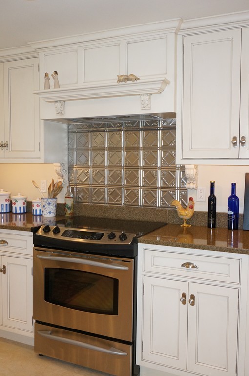 18 Jacob Gates Road Harvard, MA 01451 - Photo 7 of 26 a kitchen with granite countertop a stove sink and cabinets