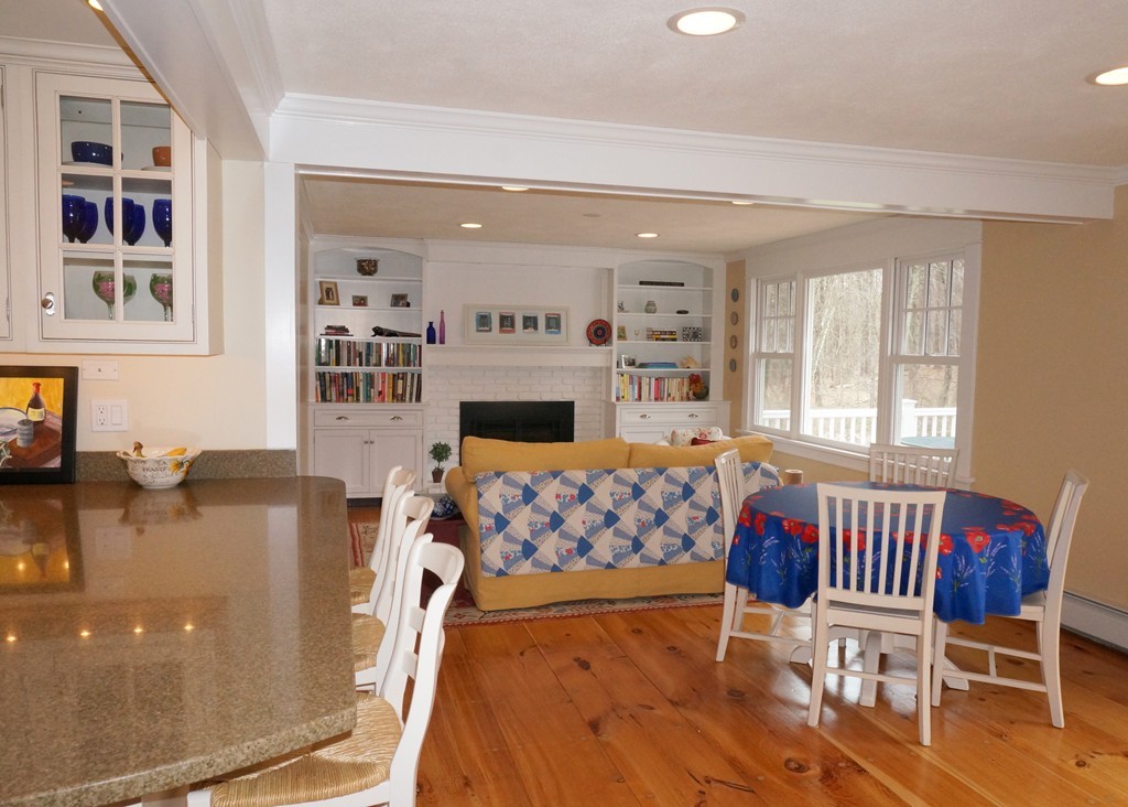 18 Jacob Gates Road Harvard, MA 01451 - Photo 9 of 26 a living room with furniture fireplace and a flat screen tv