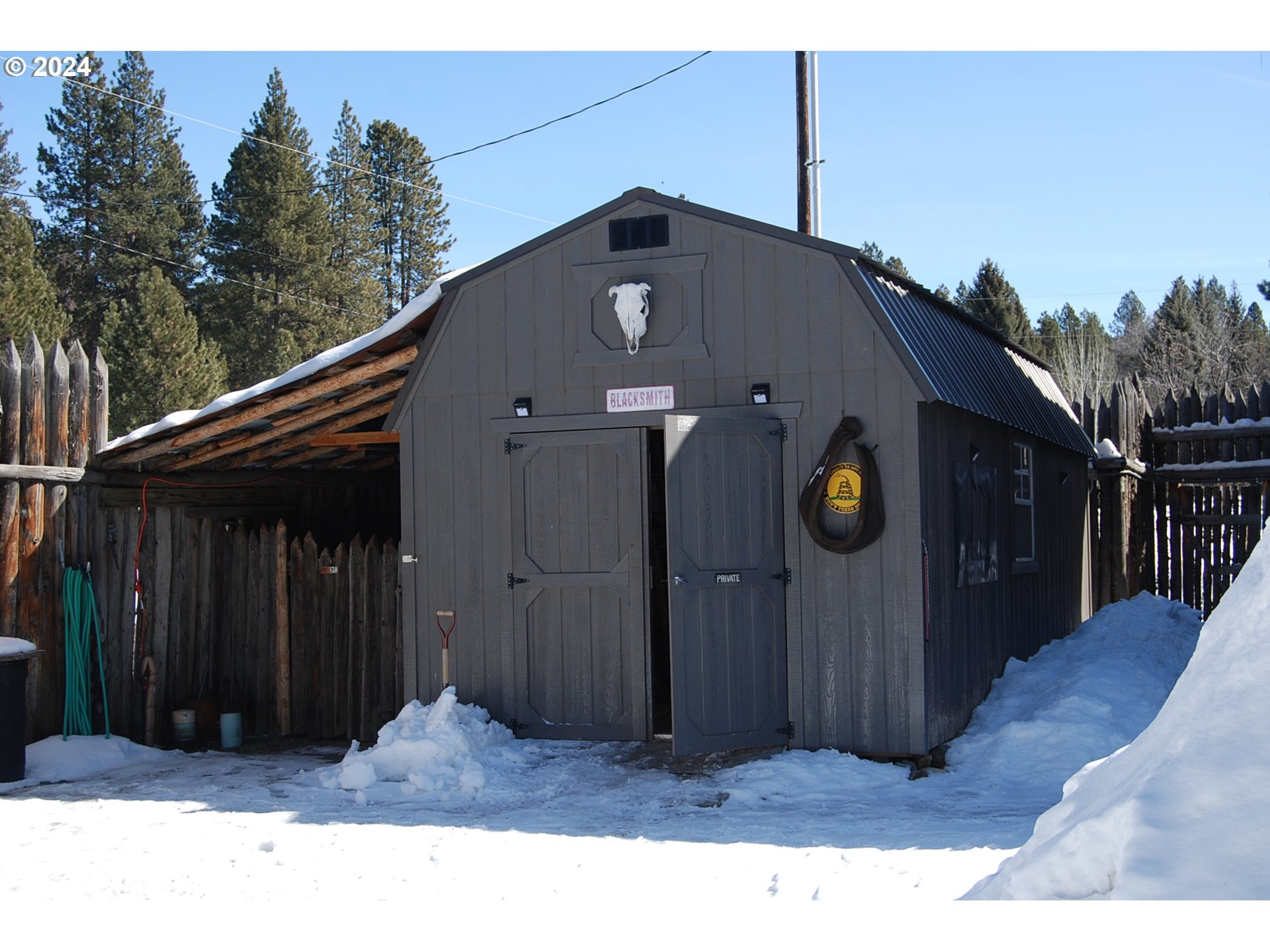 129 Austin Street Sumpter, OR 97877 - Photo 15 of 34 a black car parked in front of house