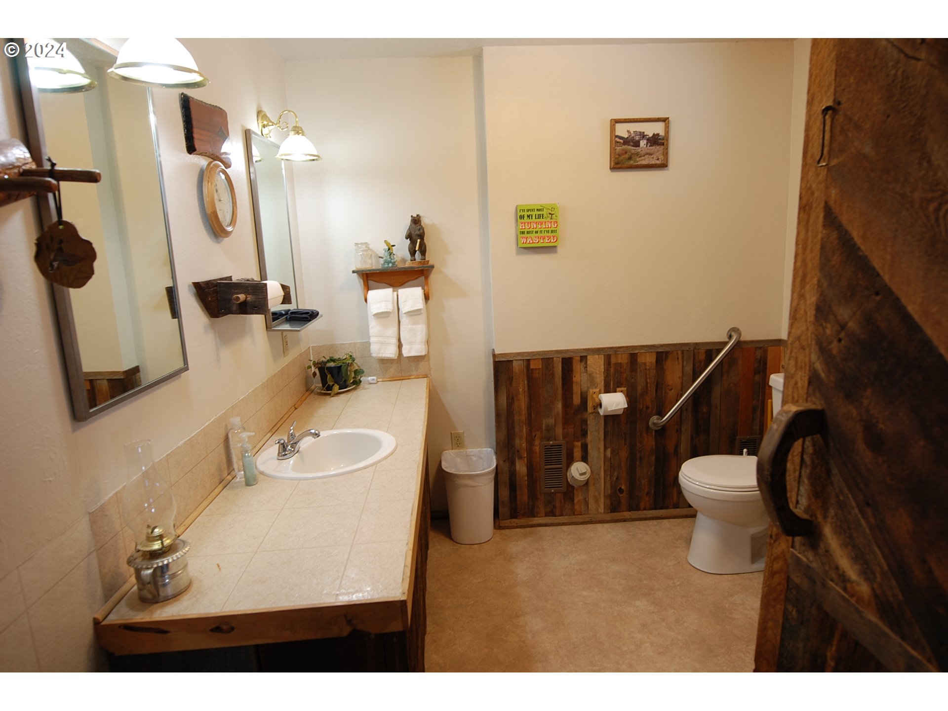 129 Austin Street Sumpter, OR 97877 - Photo 21 of 34 a bathroom with a toilet sink and mirror