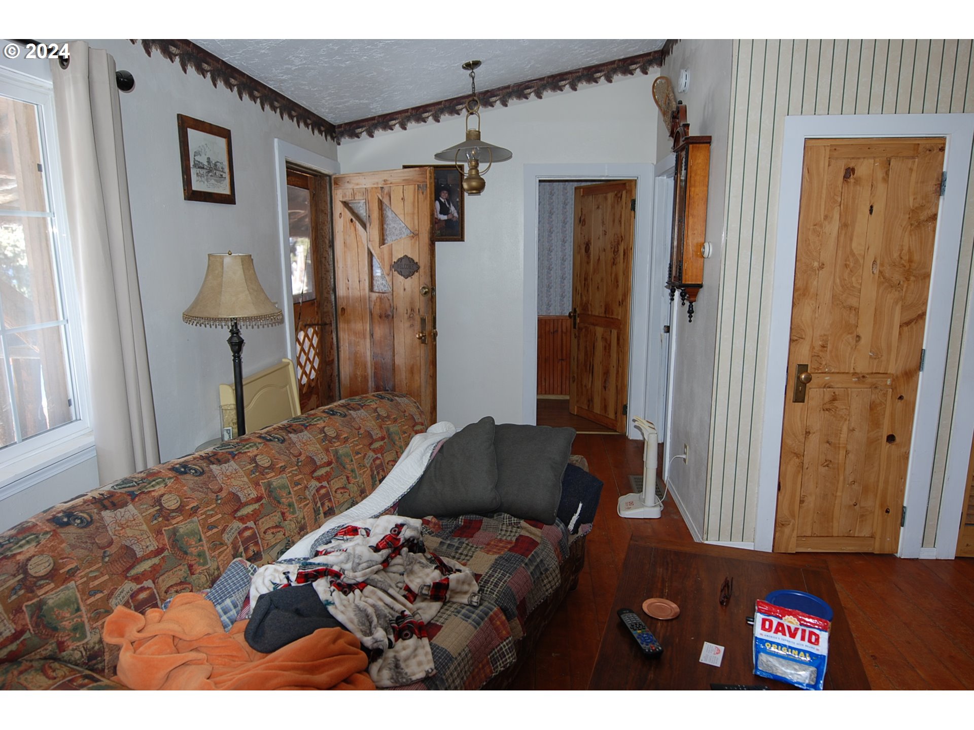 129 Austin Street Sumpter, OR 97877 - Photo 26 of 34 a bedroom with a bed and a mirror