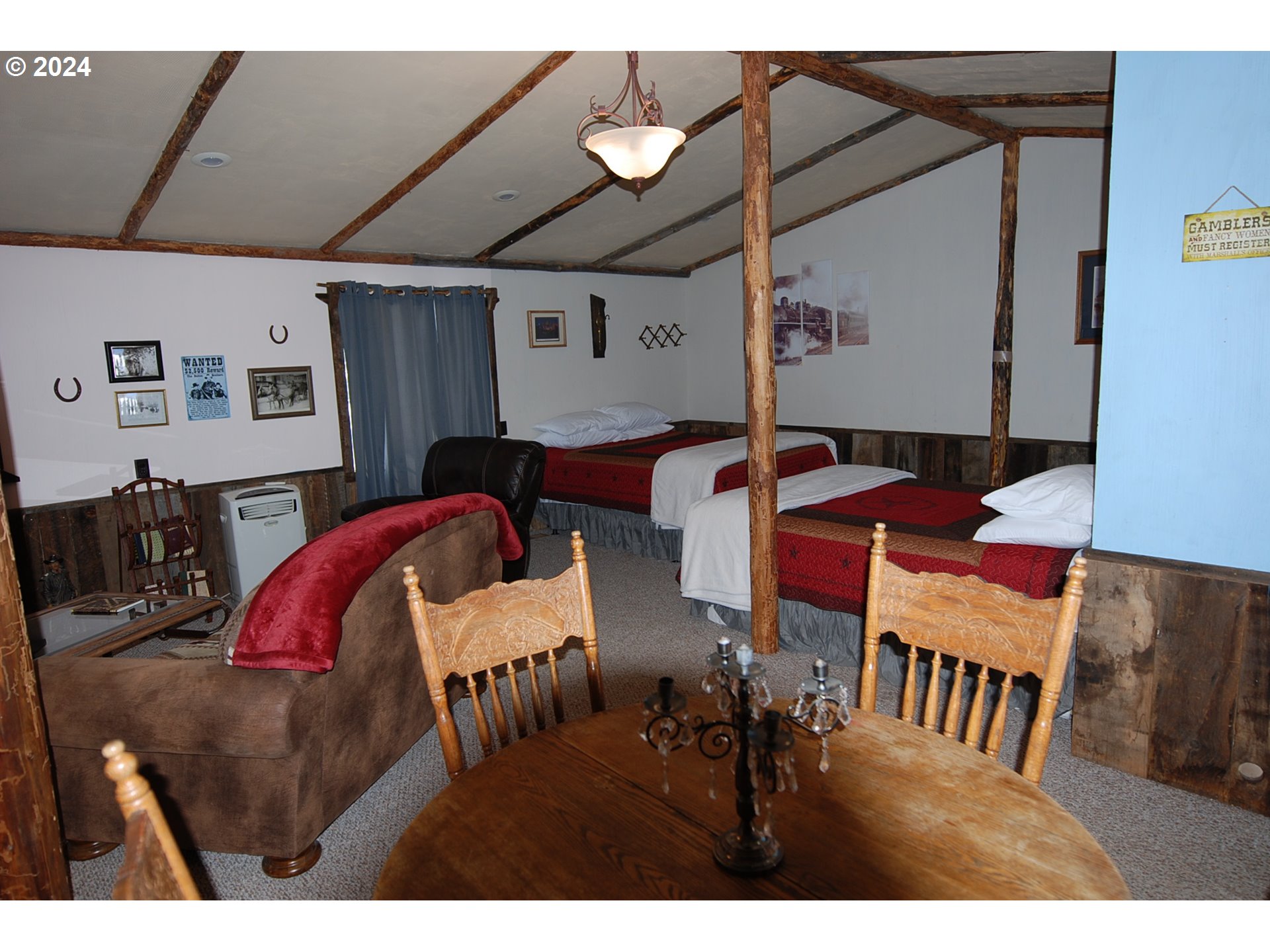 129 Austin Street Sumpter, OR 97877 - Photo 28 of 34 a view of a dining room with furniture and chandelier