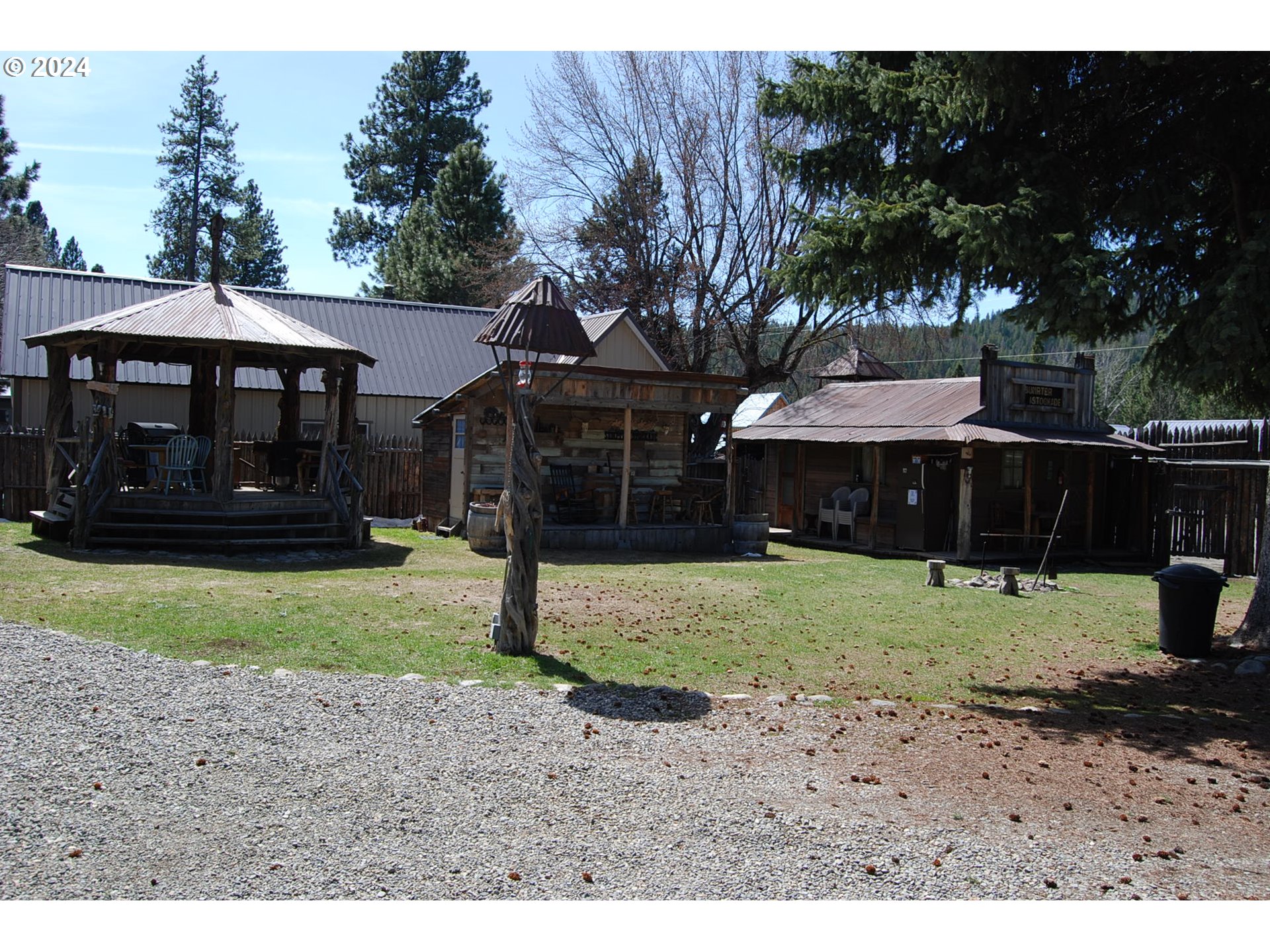 129 Austin Street Sumpter, OR 97877 - Photo 3 of 34 a front view of a house with a garden