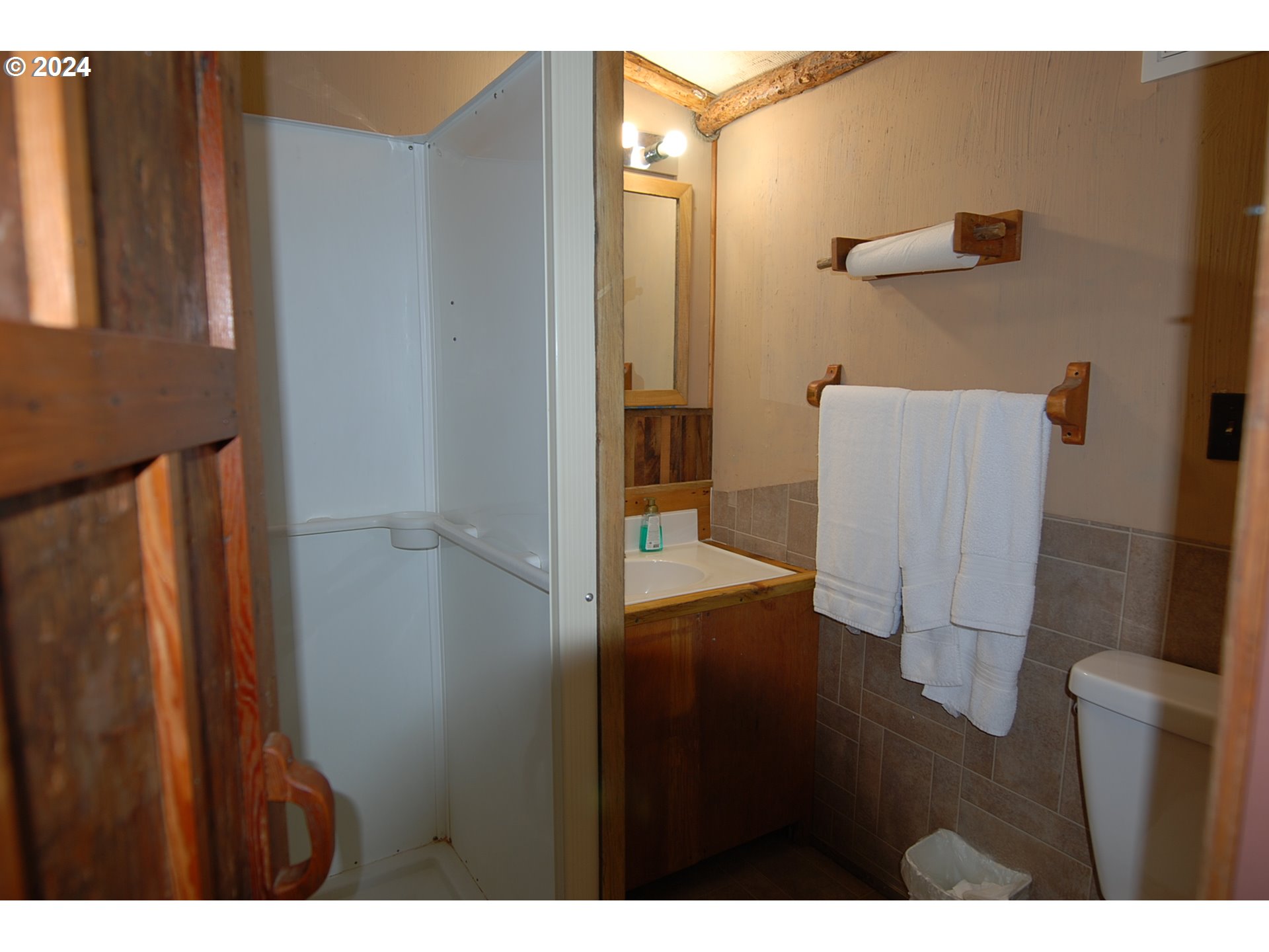 129 Austin Street Sumpter, OR 97877 - Photo 32 of 34 a bathroom with a sink and a mirror