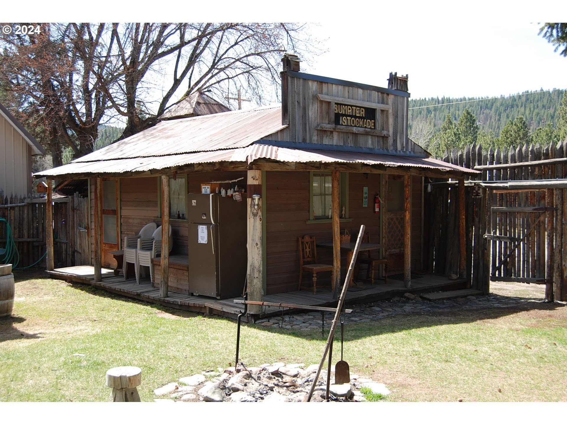 129 Austin Street Sumpter, OR 97877 - Photo 4 of 34 a backyard of a house with barbeque oven