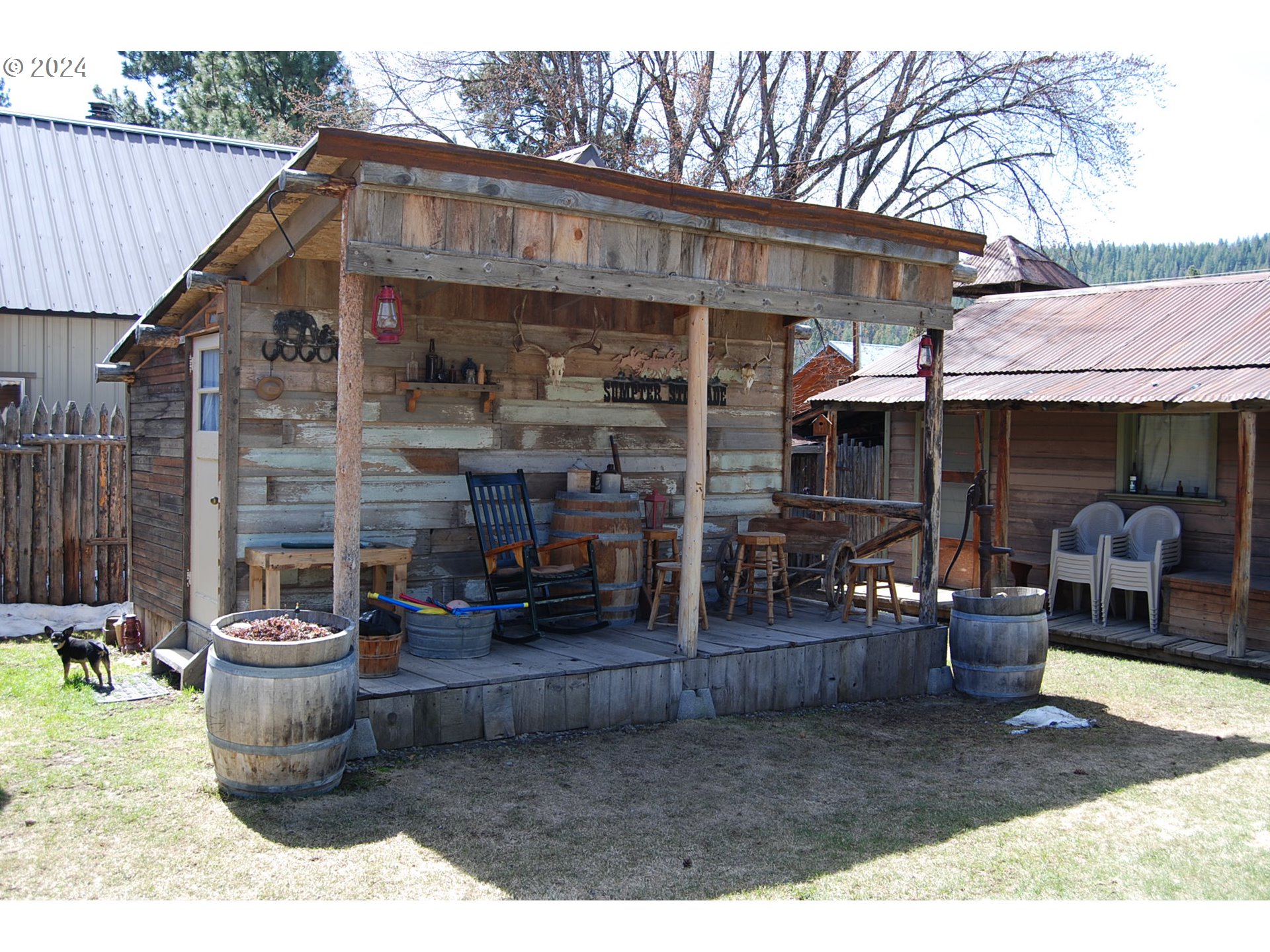 129 Austin Street Sumpter, OR 97877 - Photo 6 of 34 a view of a patio with table and chairs and wooden fence