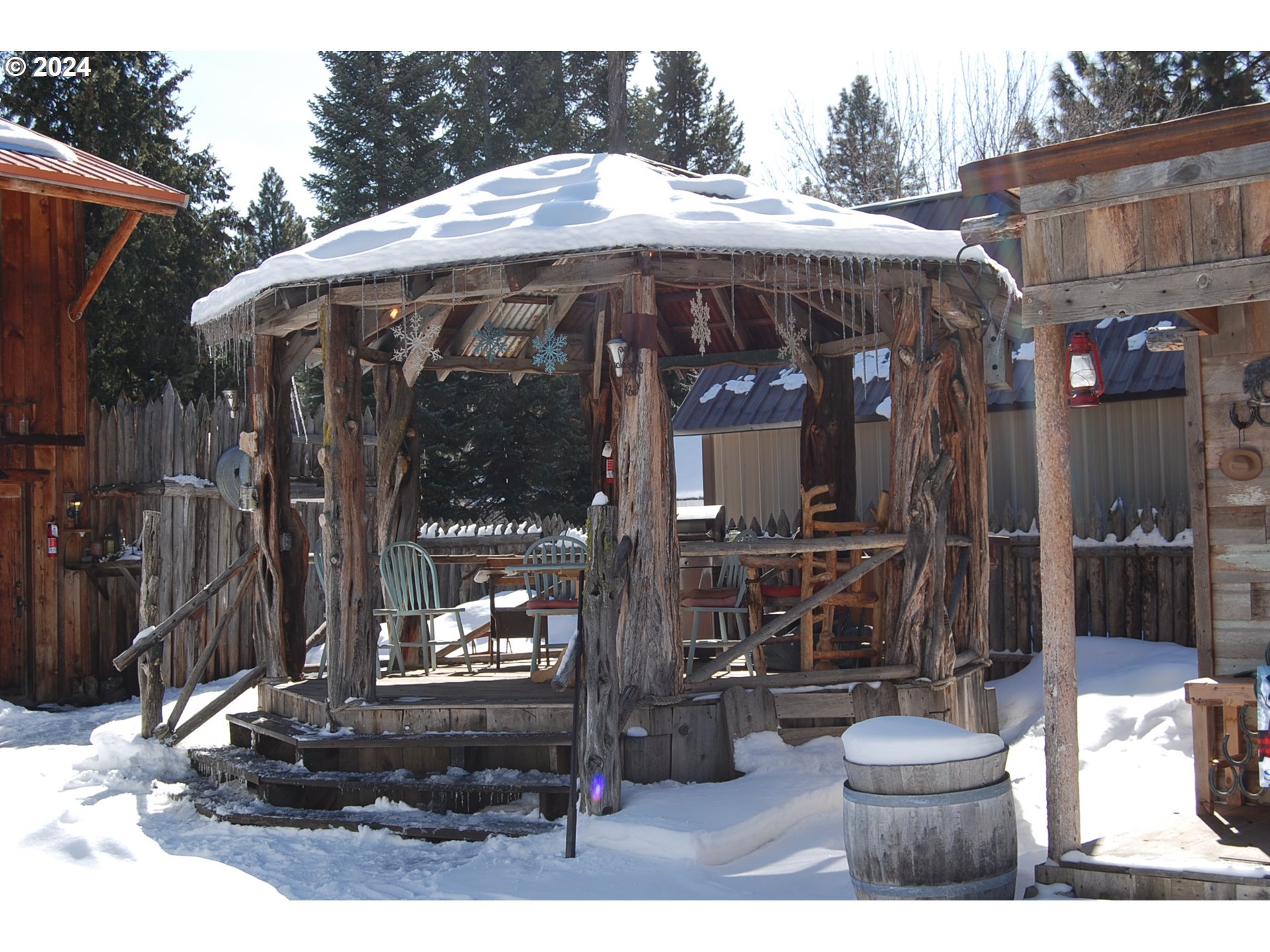 129 Austin Street Sumpter, OR 97877 - Photo 10 of 34 a view of a patio with table and chairs