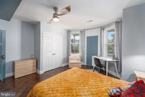 a bedroom with a bed and a table in it