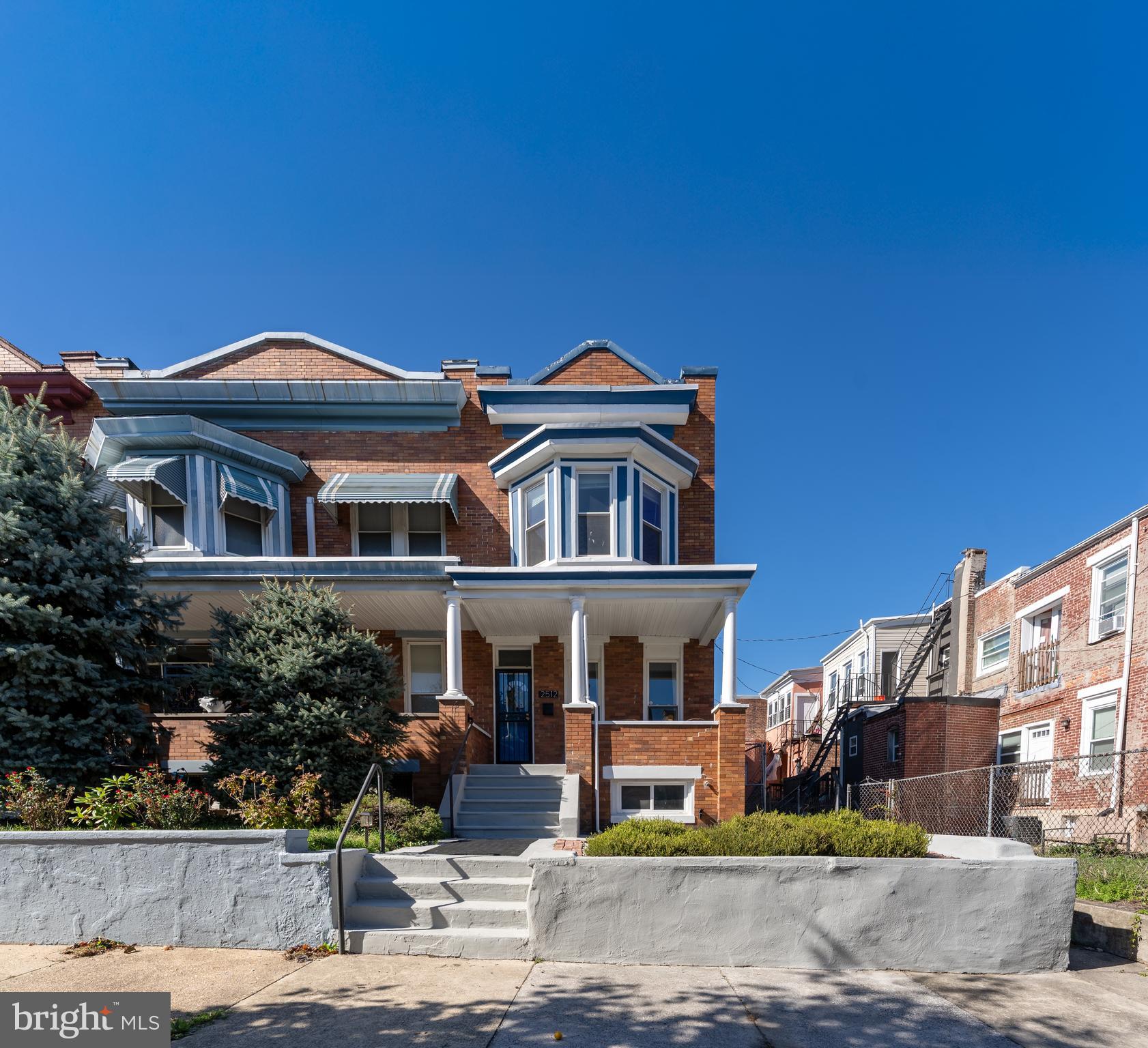 2512 Brookfield Avenue Baltimore, MD 21217 - Photo 28 of 35 a front view of a house with a garden