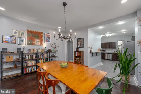 a view of a room with furniture and wooden floor