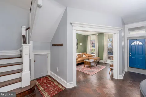 a living room with furniture and a rug