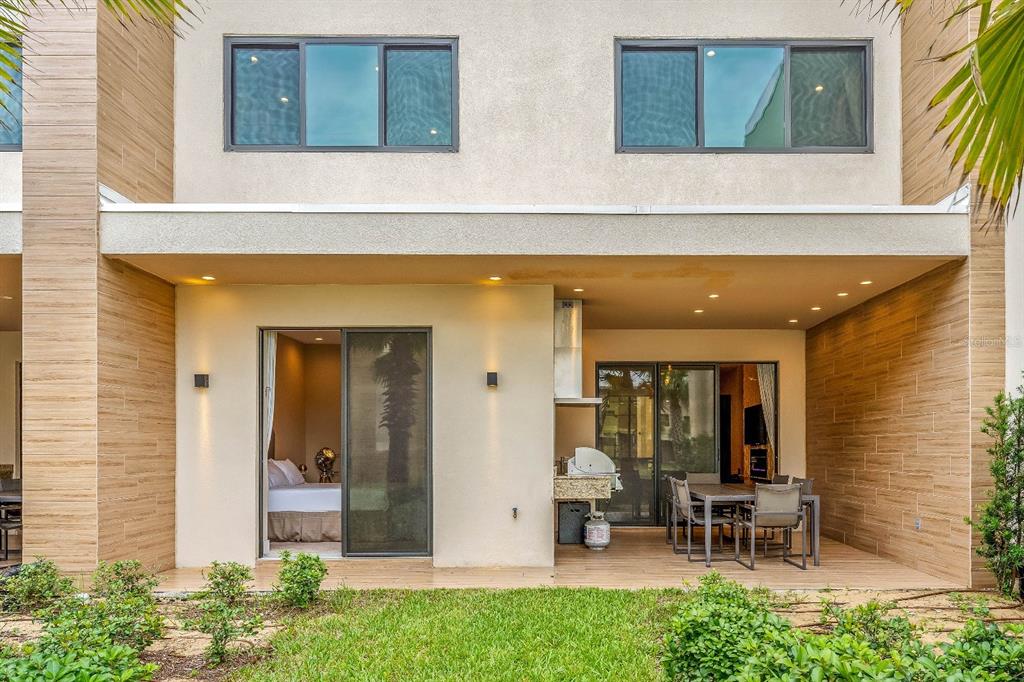 a front view of a house with outdoor seating