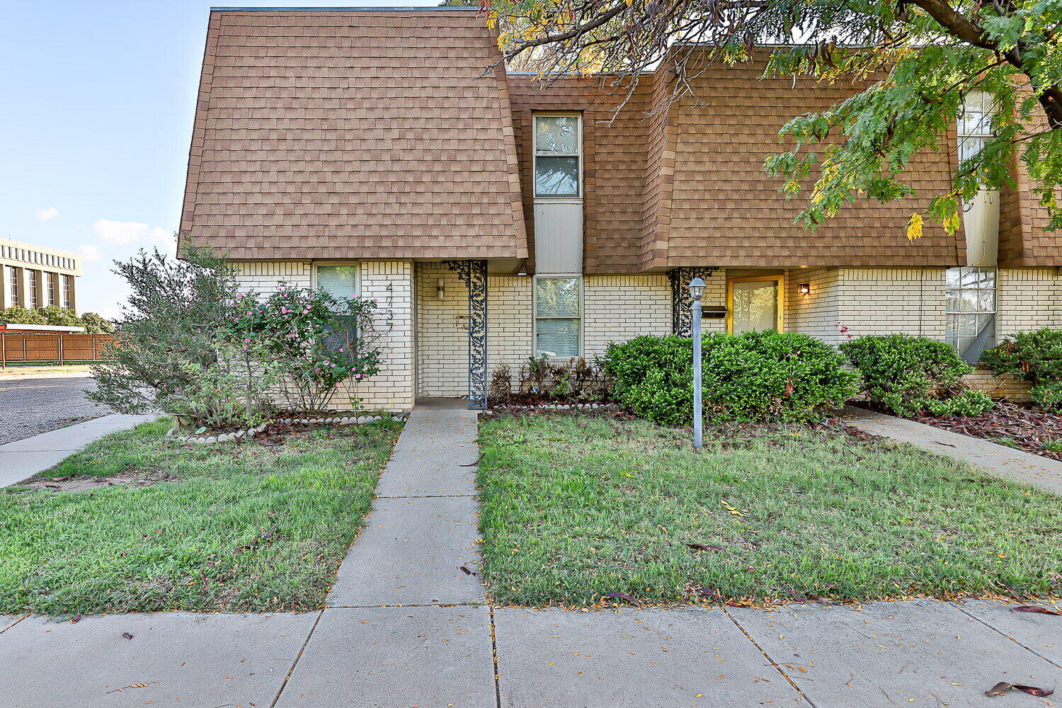 4737 48th Street Lubbock, TX 79414 - Photo 1 of 34 front view of a house with a yard