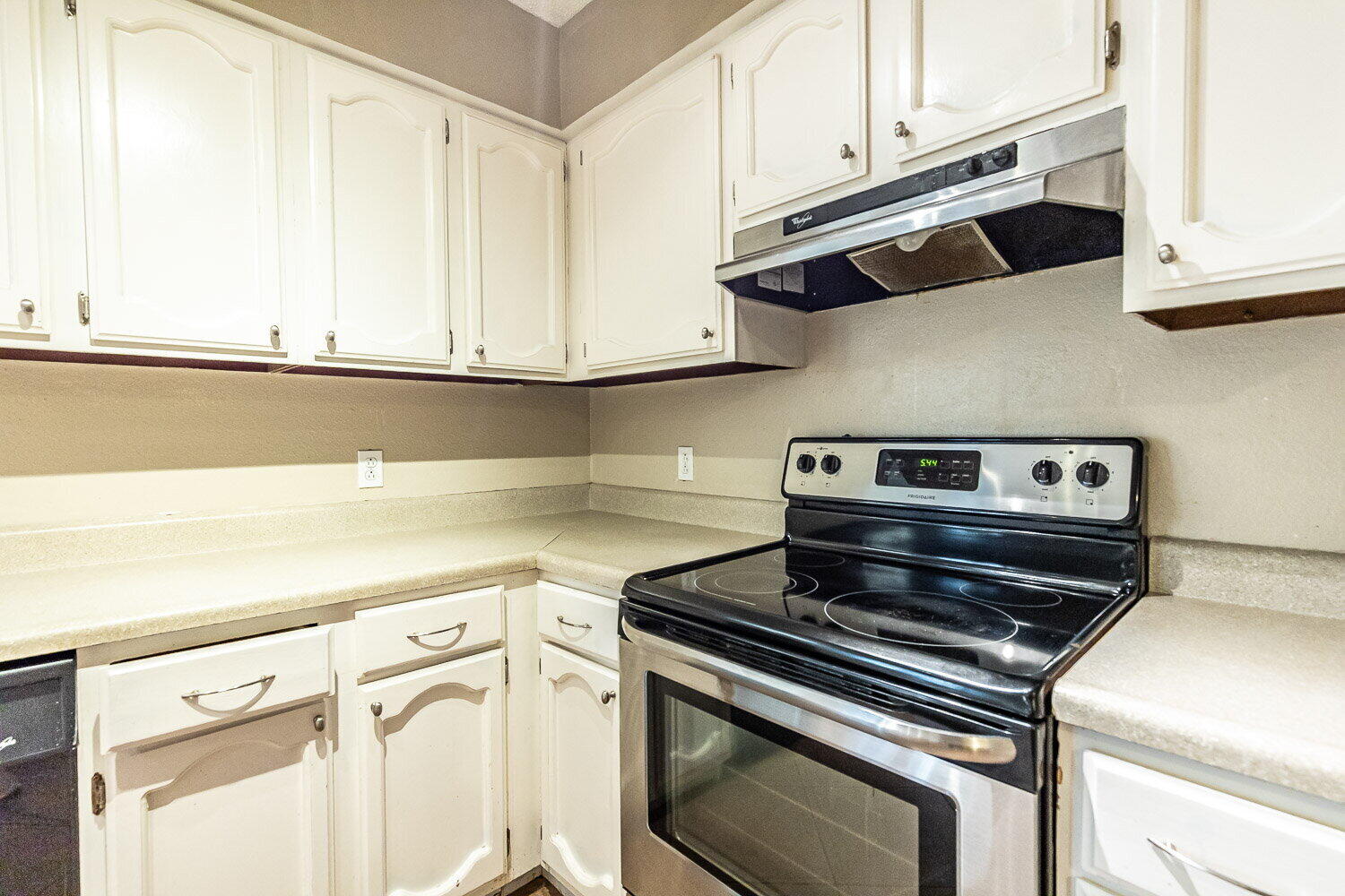 4737 48th Street Lubbock, TX 79414 - Photo 15 of 34 a kitchen with wooden cabinets and a stove top oven